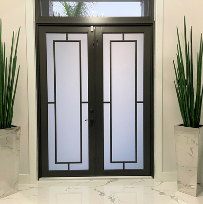 Stainless steel cube-shaped vase with snake grass.