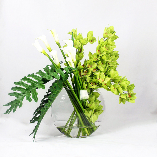 Lunar Vase with green Cymbidium orchids and Calla lilies.
