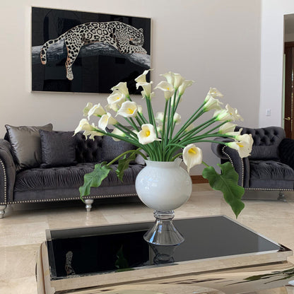 Refine vase with multiple white calla lilies